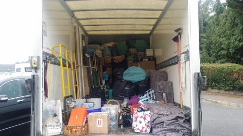 Builders skip being delivered to a construction site in Parsons Green