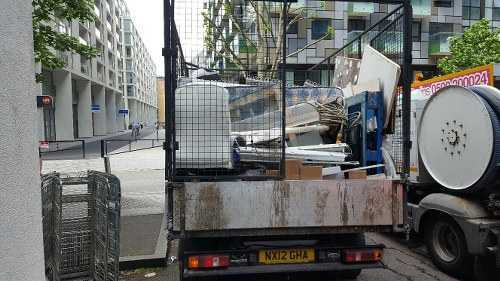 Workers managing construction waste responsibly